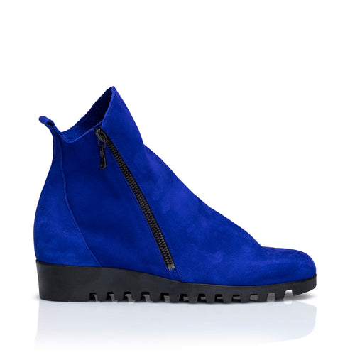 Light-up the pavement in this Klein blue soft, slouchy boot with diagonal side zip on the outside of the foot. Full-grain nubuck calfskin leather, 3.5 cm notched wedge sole, black insole, unlined with rounded toe.